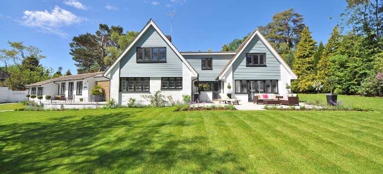 A big house with huge green area around it