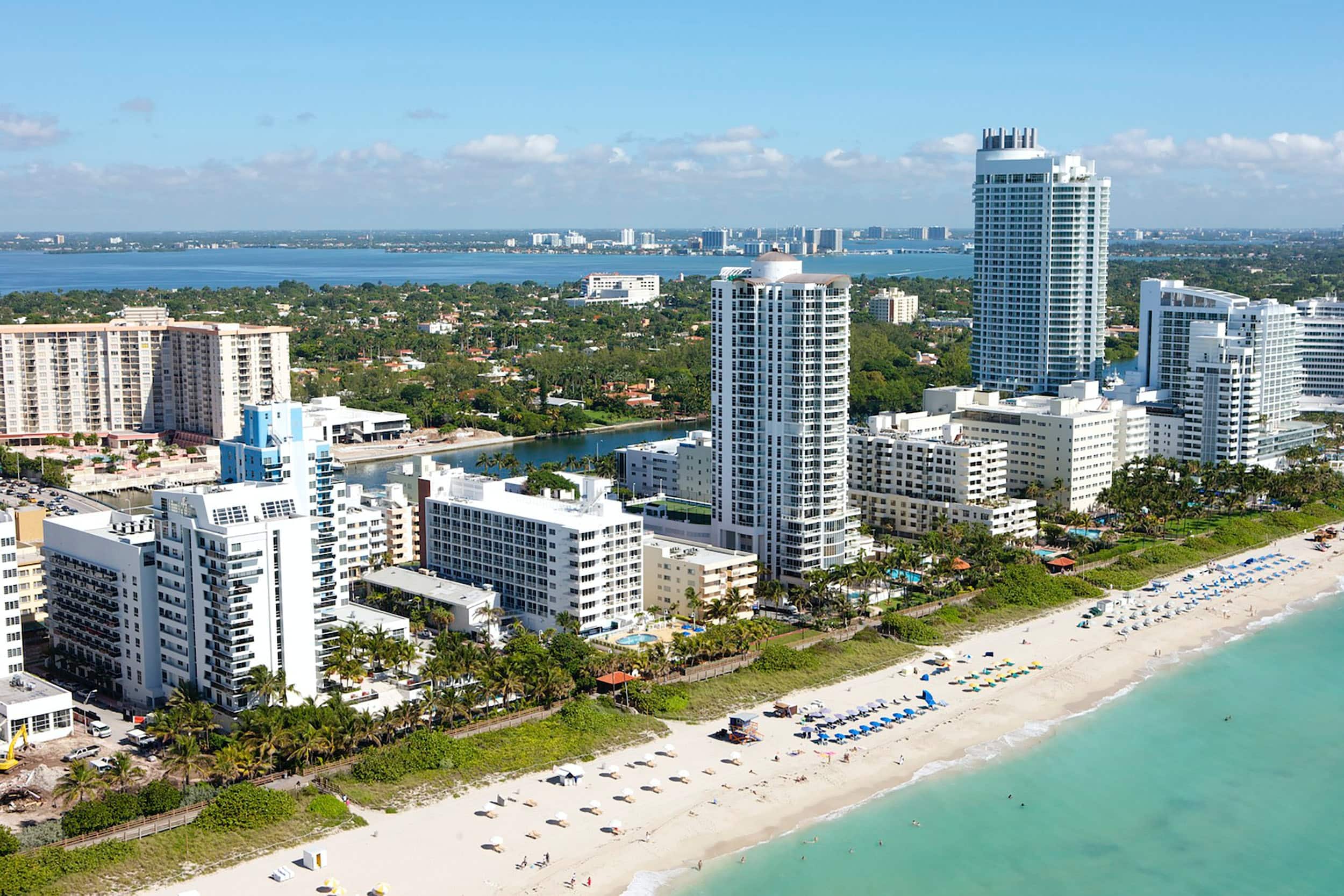 a beach and city panorama view from the ocean