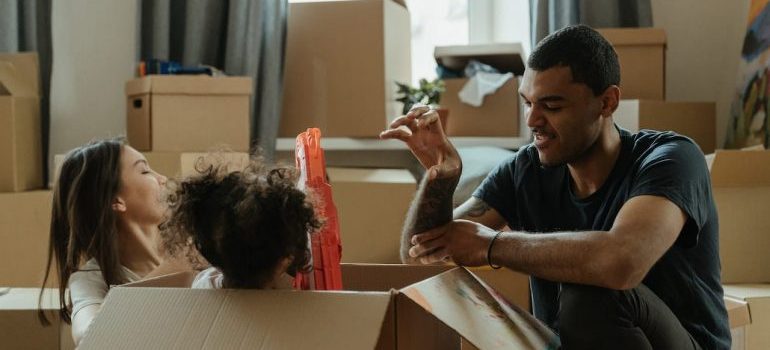 Family playing games to turn the unpacking process in Miami Beach into family fun