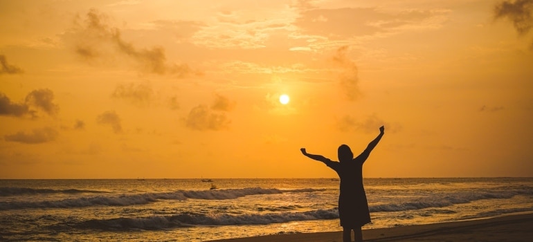 a woman on the beach after moving to one of the best places in Florida to move to after a divorce