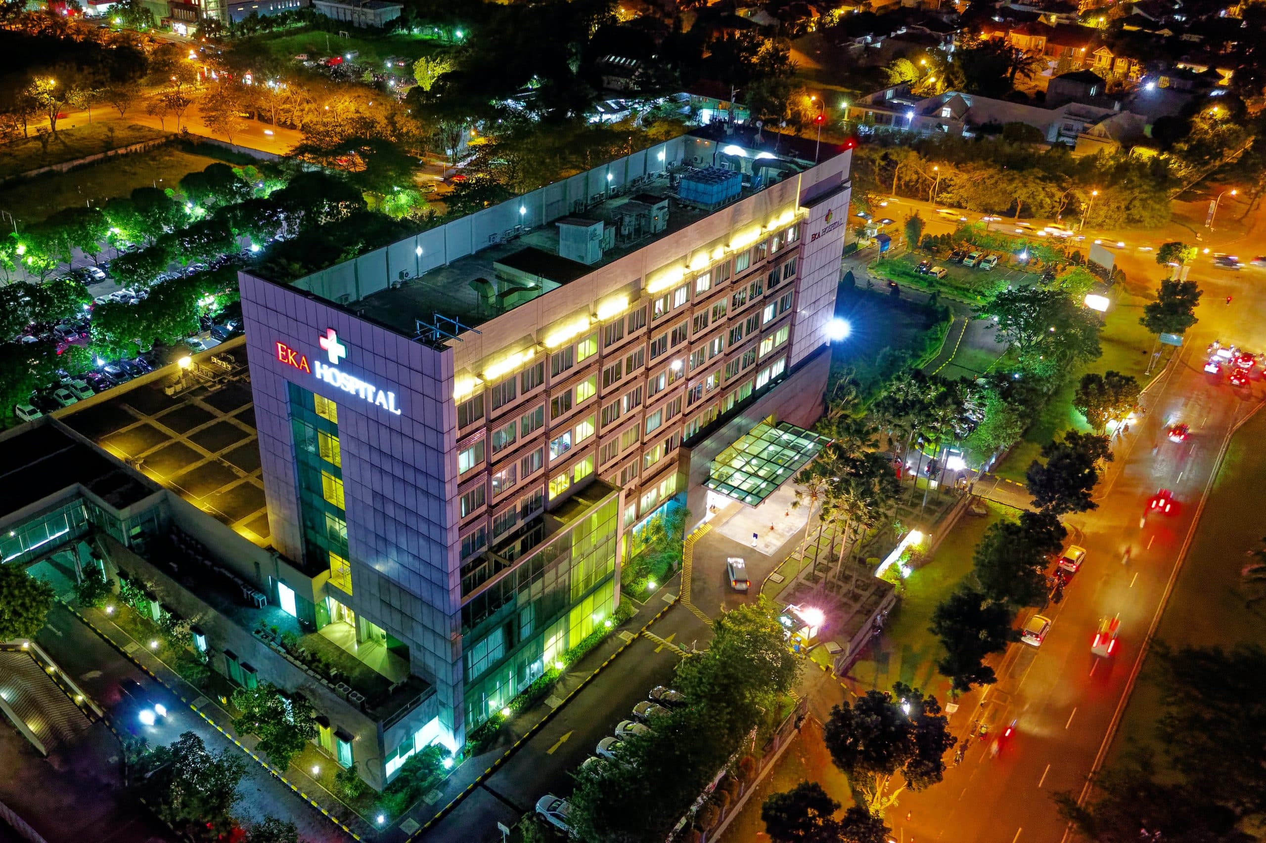 a multi-lighted building seen from the bird perspective