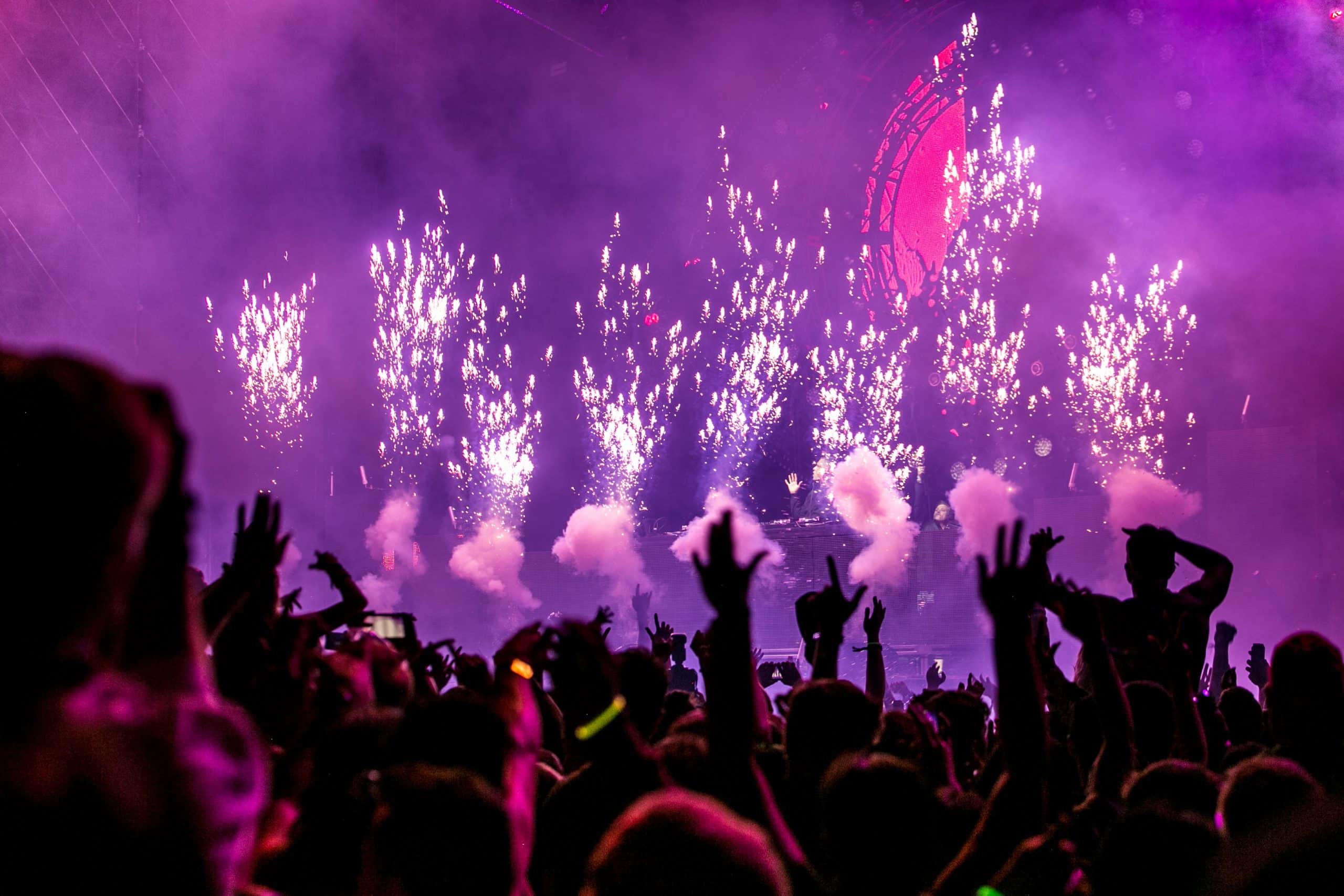 people raising hands in a club