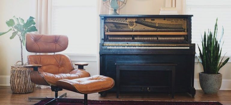 a chair, flower pots and a piano