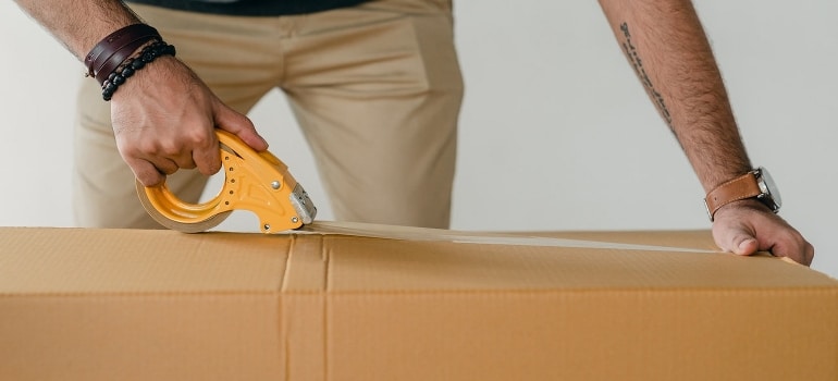 A man packing his belongings