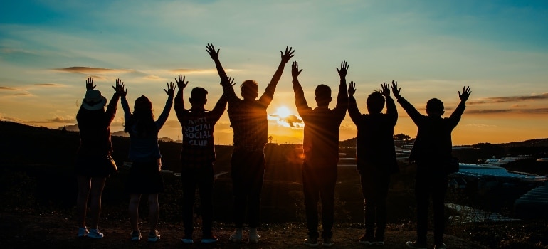group of friends watching the sunset