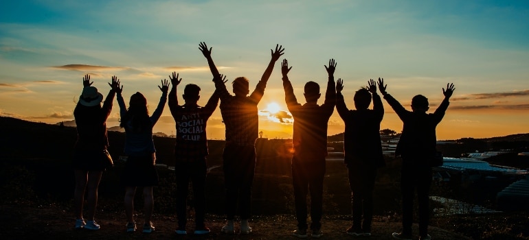 group of friends watching the sunset