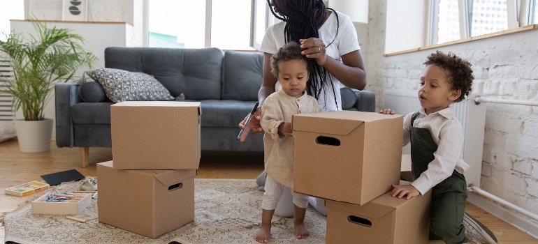 A mother with kids thinking about services that will make your Florida relocation a breeze
