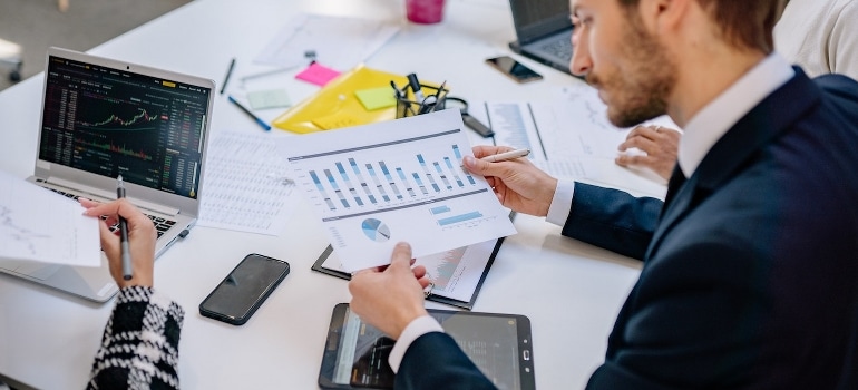 A businessman looking at graphs