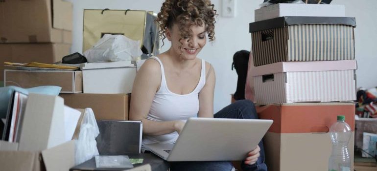 A woman reading how to easily handle packing for a family move in Florida