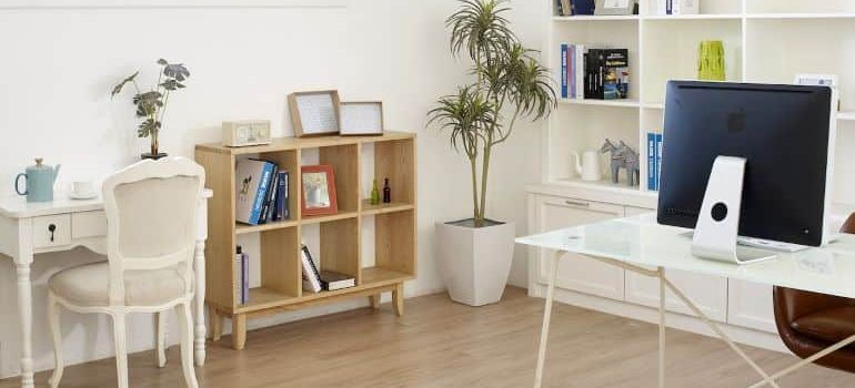 A nicely decorated living room and home office.