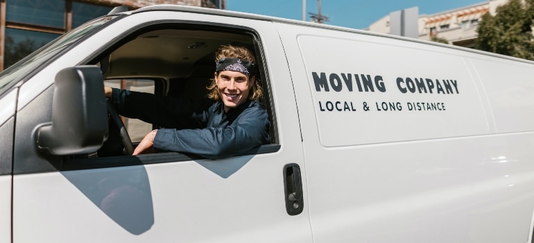 A moving company truck driver that helps you in organizing your family relocation to Miami.