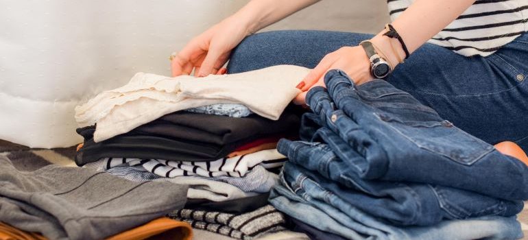 a woman packing clothing