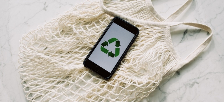 A phone with a recycle sign.