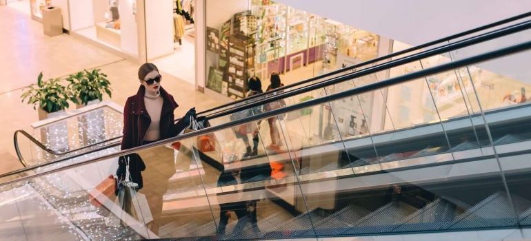 Woman with bags in a shopping mall.