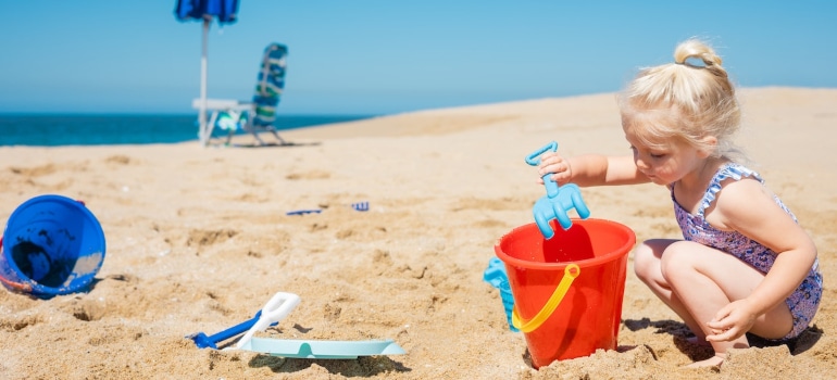 A girl playing on the beach in Palm Beach County.