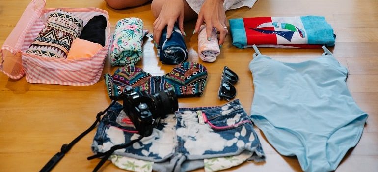 Essential items for your move to Boca Raton laid out on the floor.