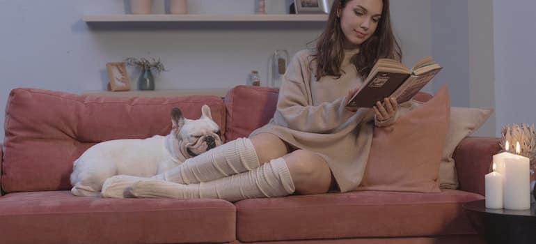 A woman reading a book after moving away from Florida.