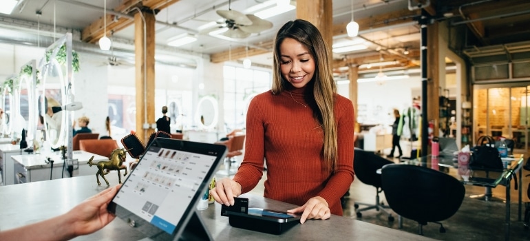 A woman pays a bill