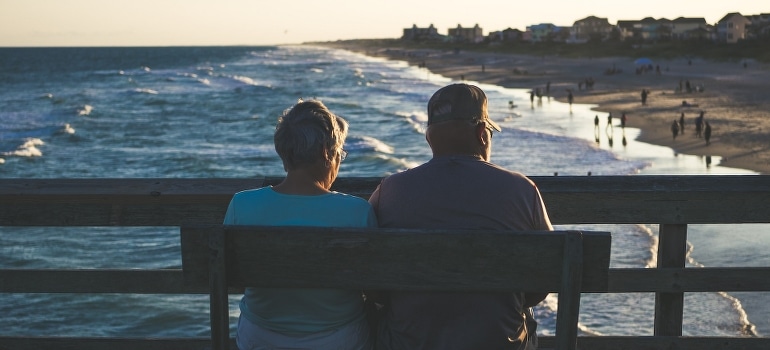 Seniors on the beach after moving to one of the retirement communities in Florida 