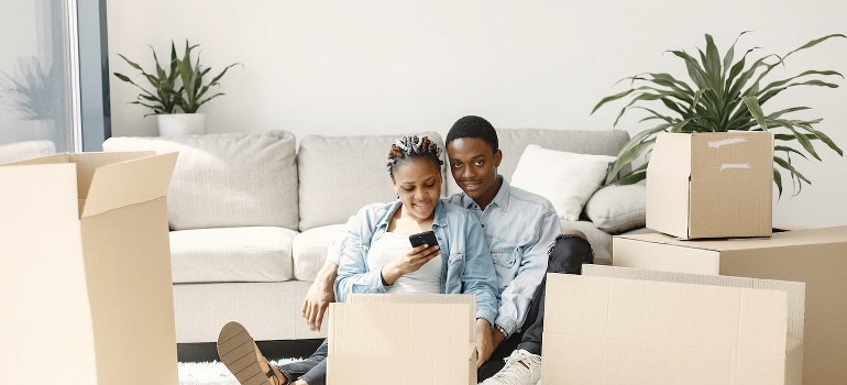 A young couple getting ready for a move by following tips for your Miramar relocation.