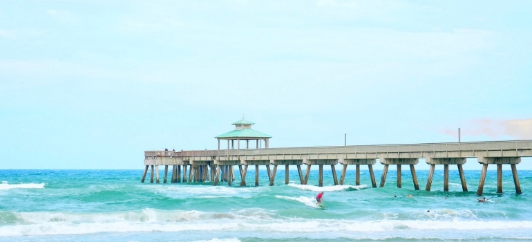 A person surfing after the move to Deerfield Beach