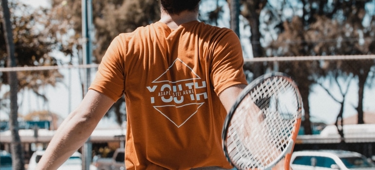 A person playing tennis in one of the best places to live near Fort Lauderdale.