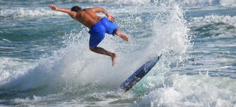 A man surfing on the waves