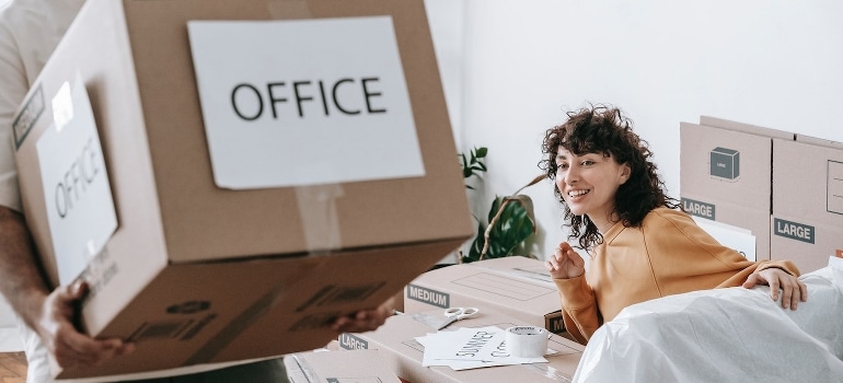 A couple about to pack and move your Boca Raton office.