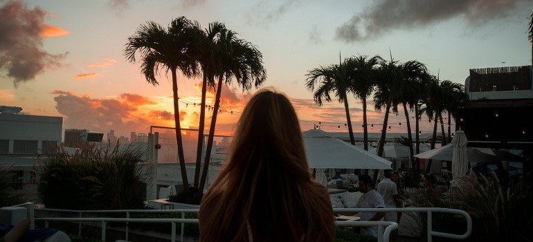 A person watching the sunset after moving from Kendall to Miami