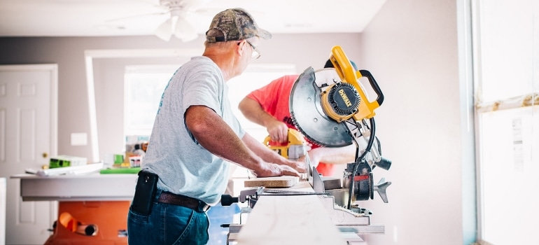 Men doing home repairs to help you stage your Kendall apartment for sale