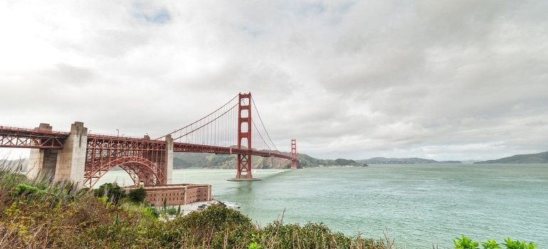 Red-painted bridge across the water