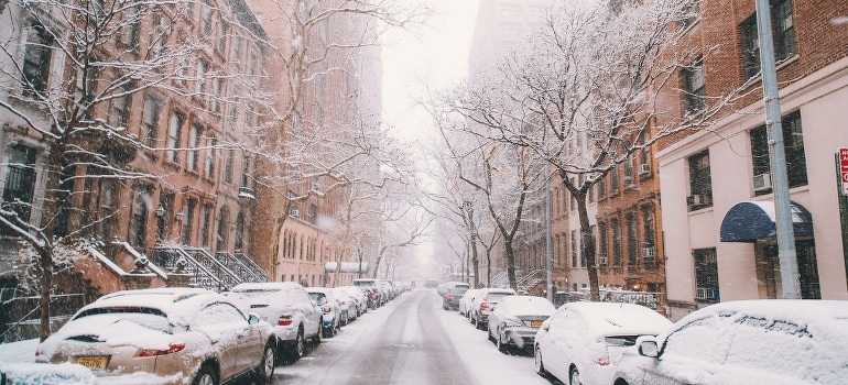 The road between vehicles covered by snow, NYC