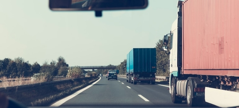 A red freight truck on the road navigates moving to Chicago from Florida