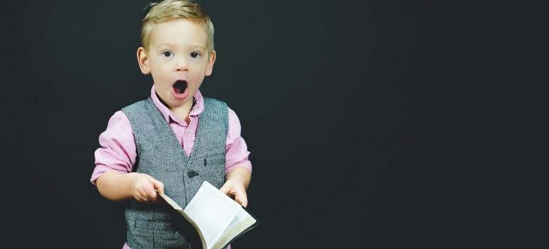 A boy holding a book