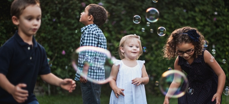 Four kids playing in the backyard