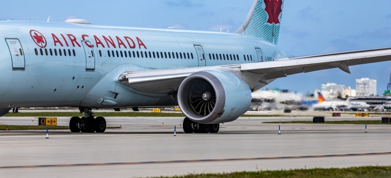 A large airplane on the runway after moving to Highland Beach.