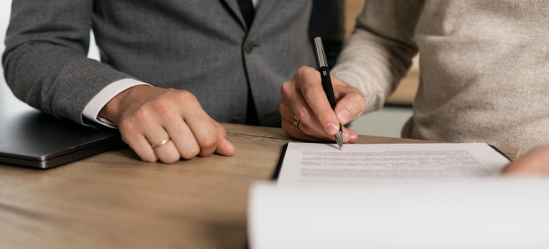 A person signing a contract