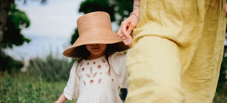 A mother and daughter holding hands in Tampa