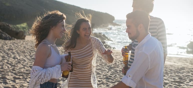 People on the beach in one of the Florida’s top cities for local relocates