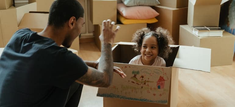 Father and a kid unpacking 