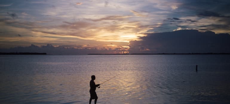 A person fishing in the perfect beach town in Florida