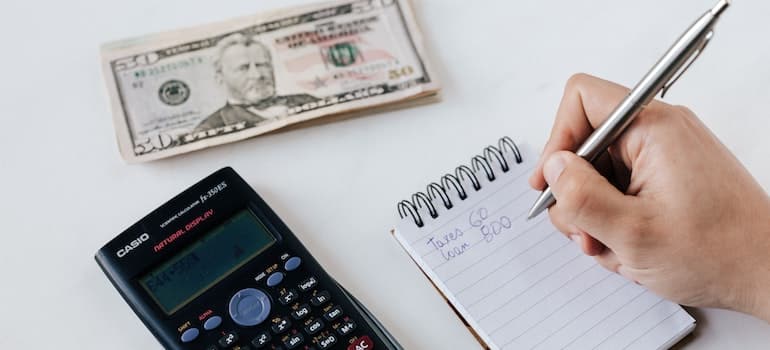 A person budgeting for a move 