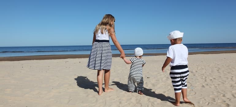 A family on the beach in the perfect beach town in Florida