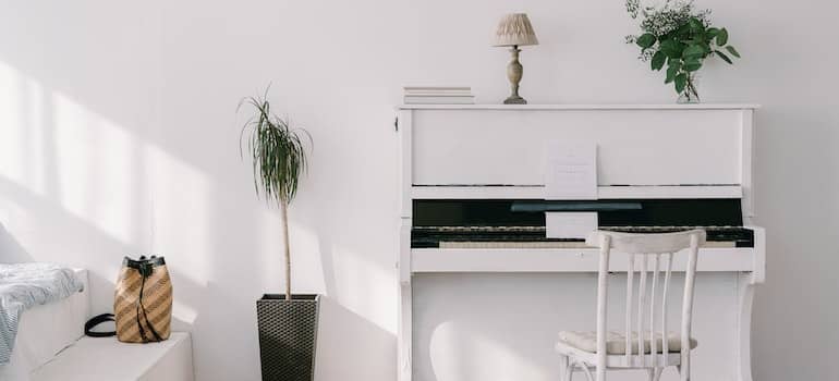 A white piano in the room