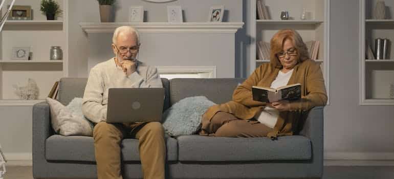 An elderly couple enjoying in their home