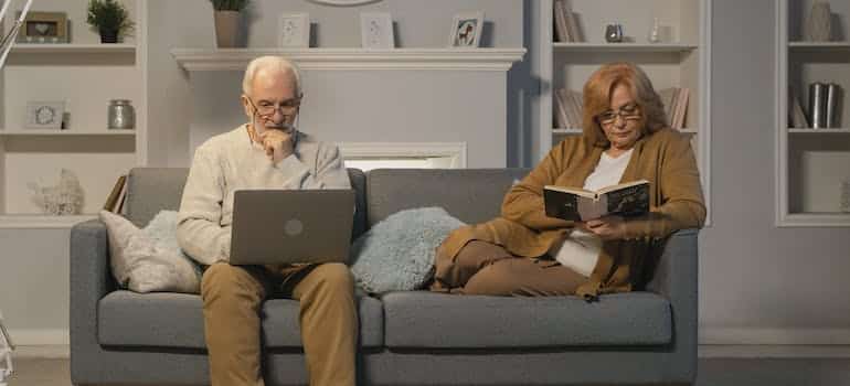 An elderly couple enjoying in their home
