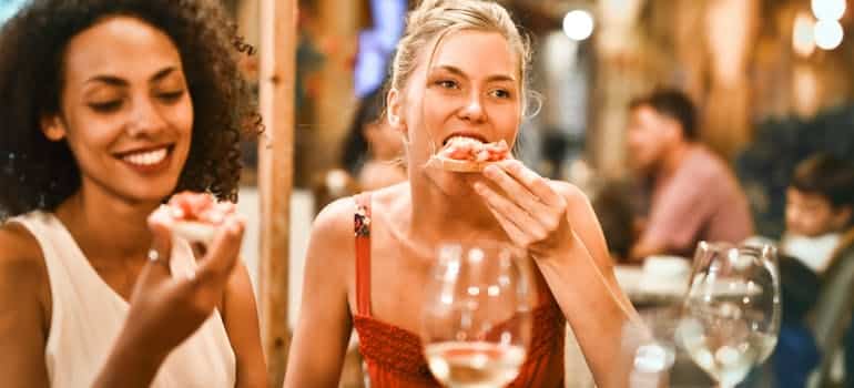 Two women eating 
