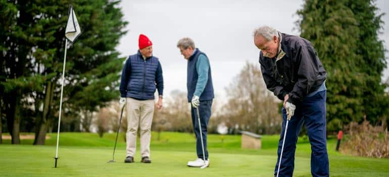 Seniors playing golf