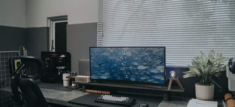 Desk with a monitor on it 