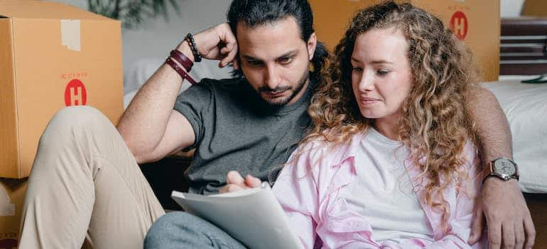 A couple writing a checklist